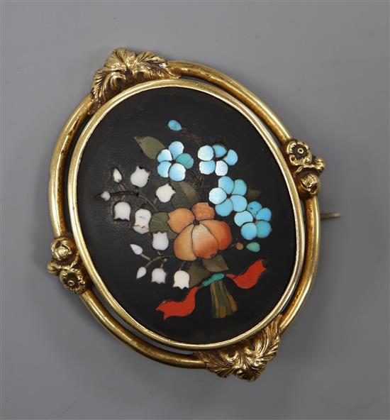 A yellow metal mounted Victorian pietra dura oval brooch, decorated with flowers and etched en verso Florence March 1857,